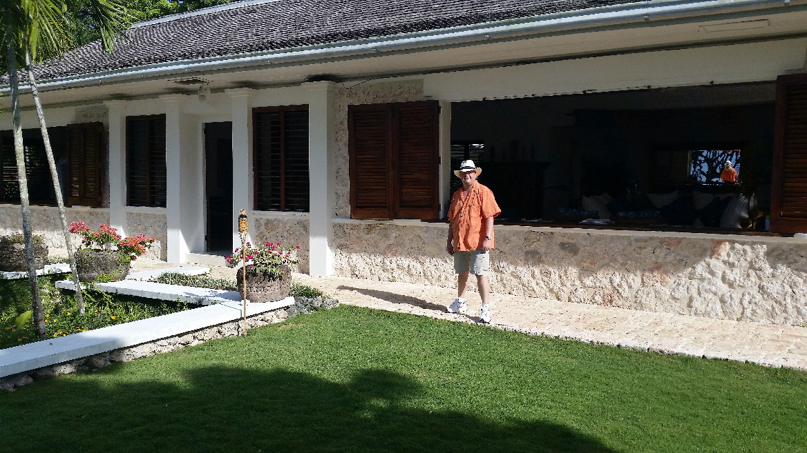 Travis standing in front of Ian Fleming's home in Jamaica